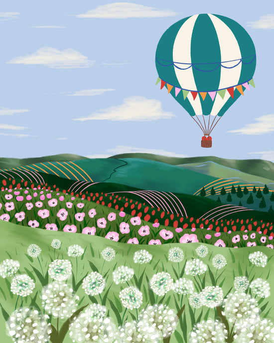 A stylized landscape illustration featuring a green and white striped hot air balloon floating above rolling hills, flower fields, and a light blue sky with clouds.